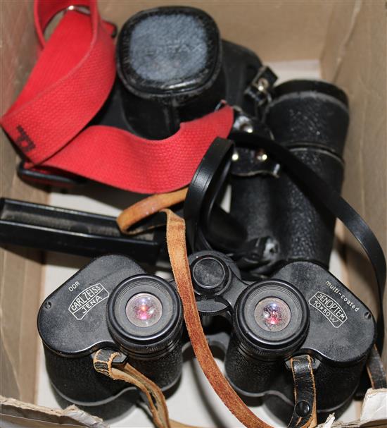A Pentax camera, Carl Zeiss binoculars and one other